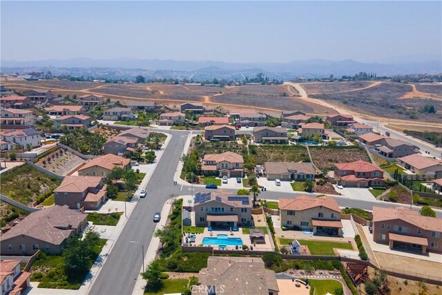 18094 Olivenhain Dr, Riverside, CA 92508 - aerial view of residential area featuring a pool and a mountainous background