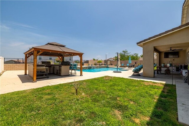 18094 Olivenhain Dr, Riverside, CA 92508 - fenced backyard with a gazebo, ceiling fan, and a patio area