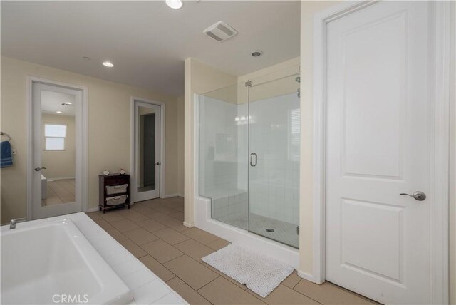 18094 Olivenhain Dr, Riverside, CA 92508 - full bath featuring a stall shower, recessed lighting, tile patterned flooring, and a bath