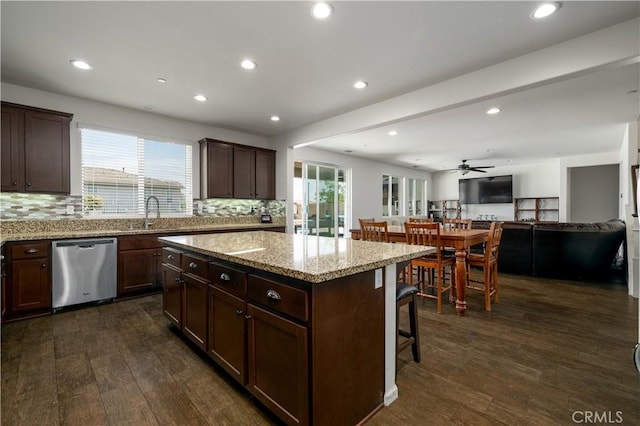 18094 Olivenhain Dr, Riverside, CA 92508 - kitchen featuring stainless steel dishwasher, open floor plan, decorative backsplash, a kitchen breakfast bar, and recessed lighting