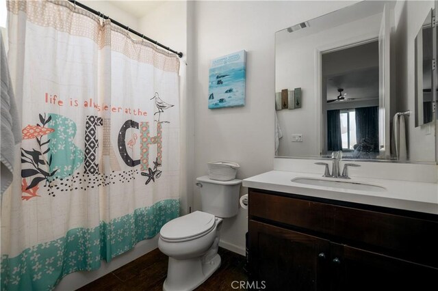 18094 Olivenhain Dr, Riverside, CA 92508 - full bathroom with vanity, wood finished floors, and a shower with shower curtain