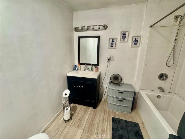 401 S R St, Lompoc, CA 93436 - bathroom with wood finished floors, vanity, and shower / washtub combination
