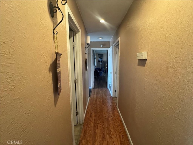 401 S R St, Lompoc, CA 93436 - corridor with wood finished floors, a textured wall, and recessed lighting
