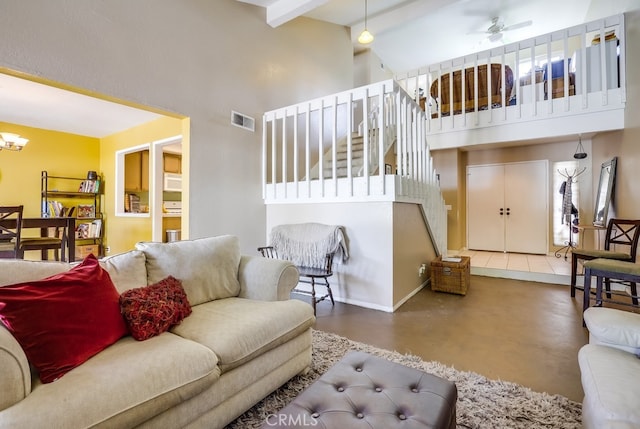 24412 Verena Ct, Mission Viejo, CA 92691 - living area with a towering ceiling, finished concrete floors, ceiling fan, a chandelier, and beamed ceiling