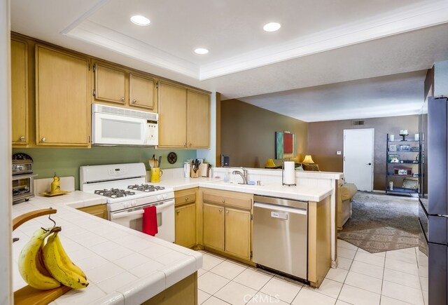 24412 Verena Ct, Mission Viejo, CA 92691 - kitchen with stainless steel appliances, tile counters, a peninsula, open floor plan, and recessed lighting