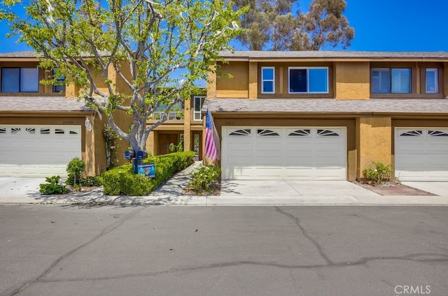 24412 Verena Ct, Mission Viejo, CA 92691 - multi unit property with stucco siding, a garage, and driveway