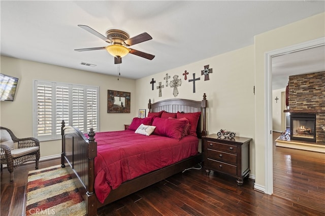 28385 Mirabelle Ln, Saugus, CA 91350 - bedroom with hardwood / wood-style floors, a stone fireplace, and ceiling fan