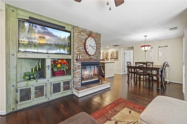 28385 Mirabelle Ln, Saugus, CA 91350 - living area featuring a ceiling fan, a stone fireplace, and wood-type flooring