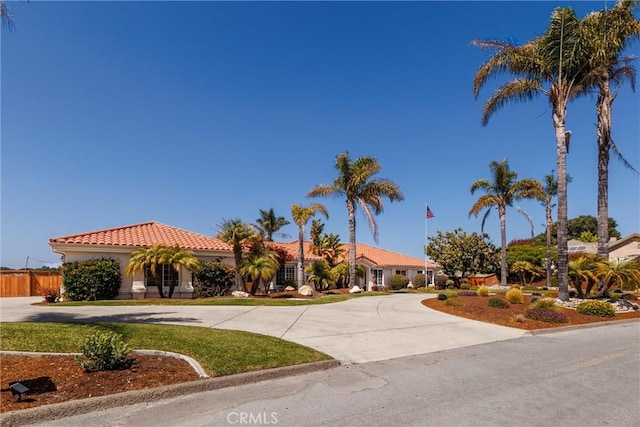 620 Camino Roble, Nipomo, CA 93444 - mediterranean / spanish house featuring curved driveway, a tiled roof, and stucco siding