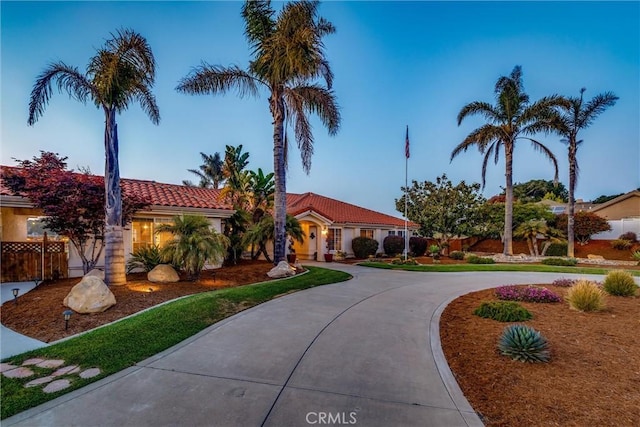 620 Camino Roble, Nipomo, CA 93444 - mediterranean / spanish home featuring a tiled roof, curved driveway, and stucco siding