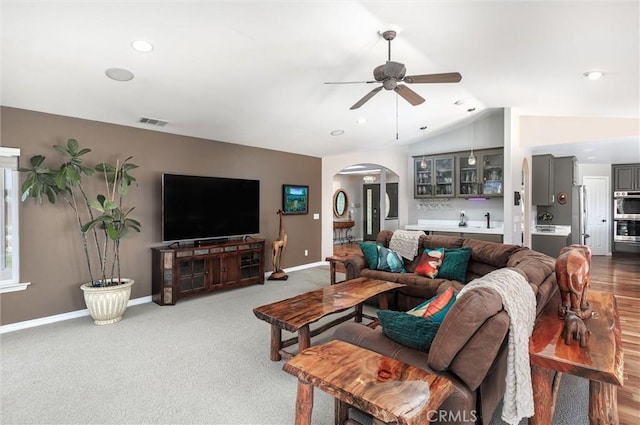 620 Camino Roble, Nipomo, CA 93444 - living area with arched walkways, ceiling fan, lofted ceiling, and carpet flooring
