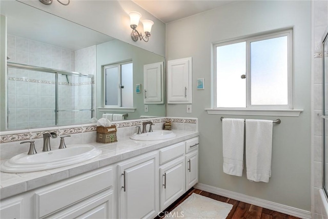 620 Camino Roble, Nipomo, CA 93444 - full bath featuring a tile shower, double vanity, and wood finished floors