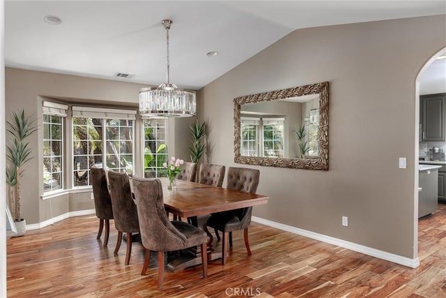 620 Camino Roble, Nipomo, CA 93444 - dining space with arched walkways, lofted ceiling, light wood-type flooring, and healthy amount of natural light