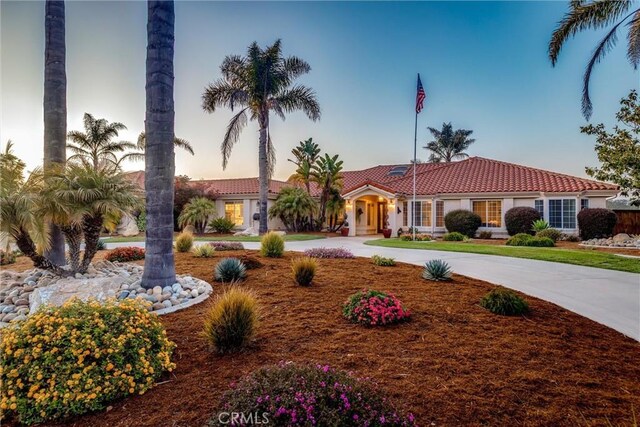 620 Camino Roble, Nipomo, CA 93444 - mediterranean / spanish home featuring a tiled roof, stucco siding, and curved driveway