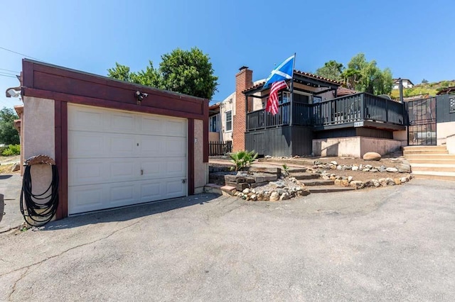 9602 Riverview Ave, Lakeside, CA 92040 - view of front of home with a garage, an outdoor structure, driveway, and stucco siding