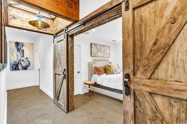 27151 Mission Hills Dr, San Juan Capistrano, CA 92675 - bedroom featuring a barn door and concrete floors