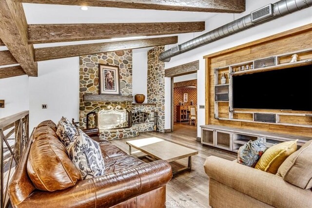 27151 Mission Hills Dr, San Juan Capistrano, CA 92675 - living room with wood finished floors and a stone fireplace