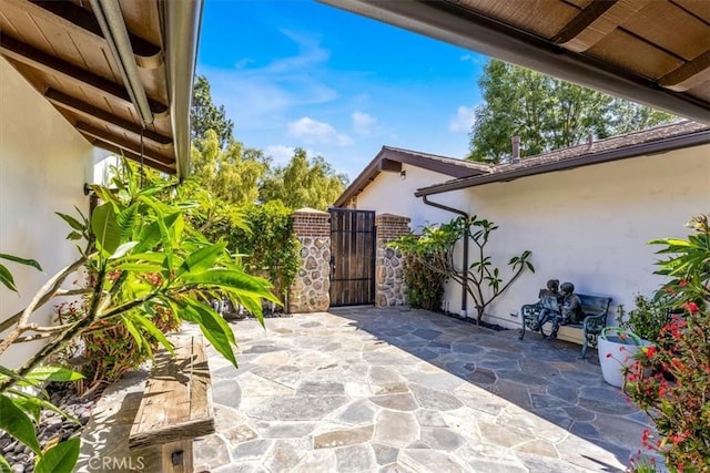 27151 Mission Hills Dr, San Juan Capistrano, CA 92675 - view of patio featuring a gate