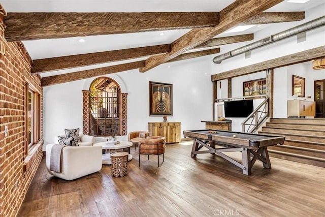 27151 Mission Hills Dr, San Juan Capistrano, CA 92675 - living area with hardwood / wood-style flooring, brick wall, and stairway