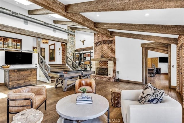 27151 Mission Hills Dr, San Juan Capistrano, CA 92675 - living area featuring wood finished floors, a fireplace, and stairway