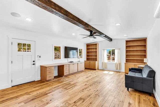 27151 Mission Hills Dr, San Juan Capistrano, CA 92675 - living area with light wood-type flooring, beamed ceiling, ceiling fan, built in shelves, and built in study area
