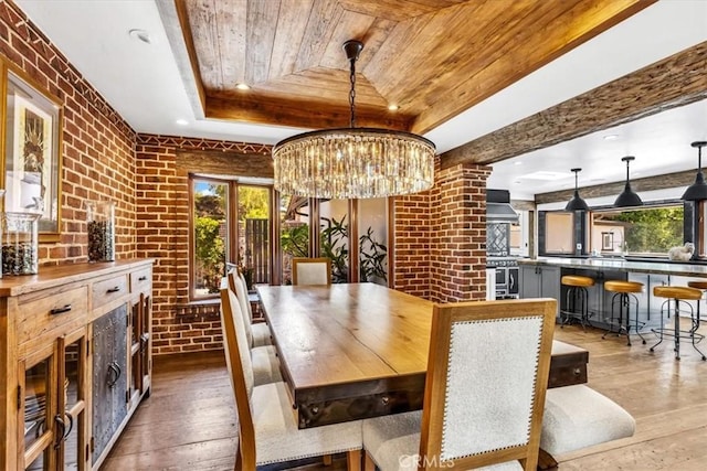 27151 Mission Hills Dr, San Juan Capistrano, CA 92675 - dining area with wood ceiling, a raised ceiling, plenty of natural light, brick wall, and hardwood / wood-style flooring