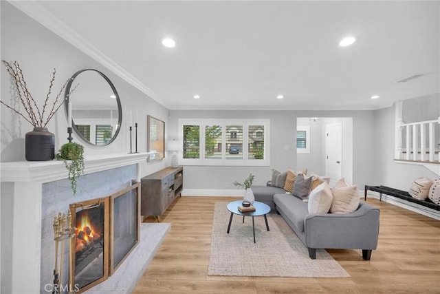 12012 Paseo Bonita, Los Alamitos, CA 90720 - living area featuring ornamental molding, recessed lighting, light wood-type flooring, and a premium fireplace
