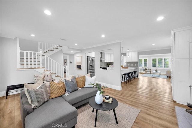 12012 Paseo Bonita, Los Alamitos, CA 90720 - living room with stairs, recessed lighting, ornamental molding, and light wood-style flooring