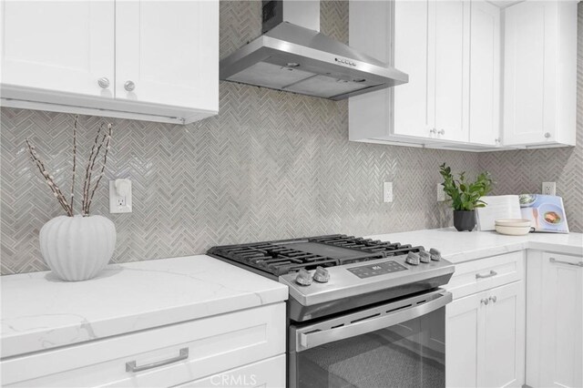 12012 Paseo Bonita, Los Alamitos, CA 90720 - kitchen featuring wall chimney range hood, gas stove, backsplash, white cabinets, and light stone countertops