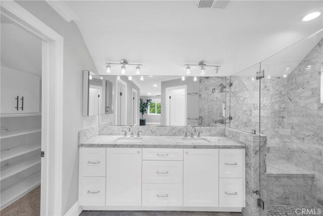 12012 Paseo Bonita, Los Alamitos, CA 90720 - bathroom featuring a marble finish shower, double vanity, and recessed lighting