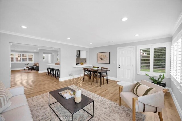 12012 Paseo Bonita, Los Alamitos, CA 90720 - living room with ornamental molding, recessed lighting, and light wood finished floors