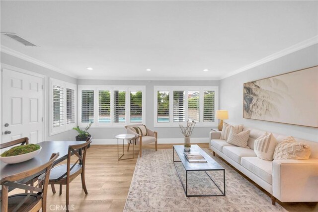 12012 Paseo Bonita, Los Alamitos, CA 90720 - living area featuring light wood-style floors, ornamental molding, and recessed lighting