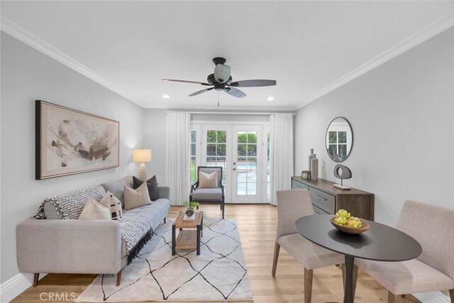 12012 Paseo Bonita, Los Alamitos, CA 90720 - living area with french doors, light wood finished floors, ceiling fan, crown molding, and recessed lighting