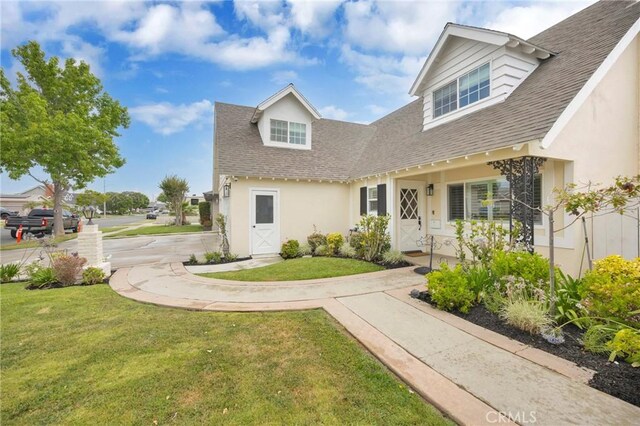 12012 Paseo Bonita, Los Alamitos, CA 90720 - view of front of home with a front lawn, roof with shingles, and stucco siding