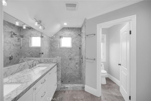 12012 Paseo Bonita, Los Alamitos, CA 90720 - bathroom featuring a marble finish shower, double vanity, and vaulted ceiling