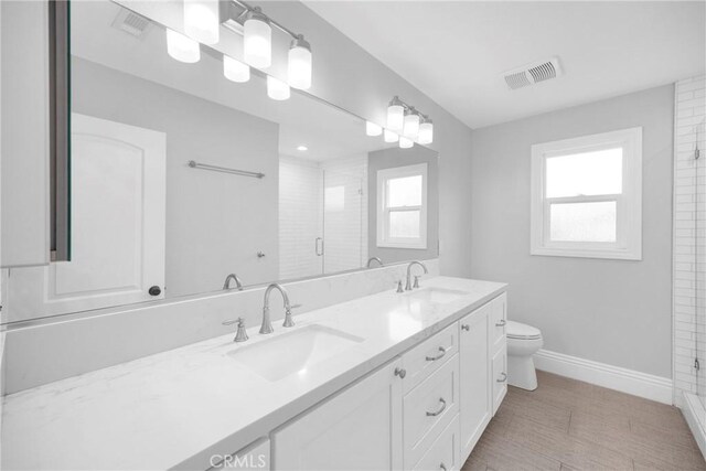 12012 Paseo Bonita, Los Alamitos, CA 90720 - bathroom with plenty of natural light, double vanity, and a shower stall