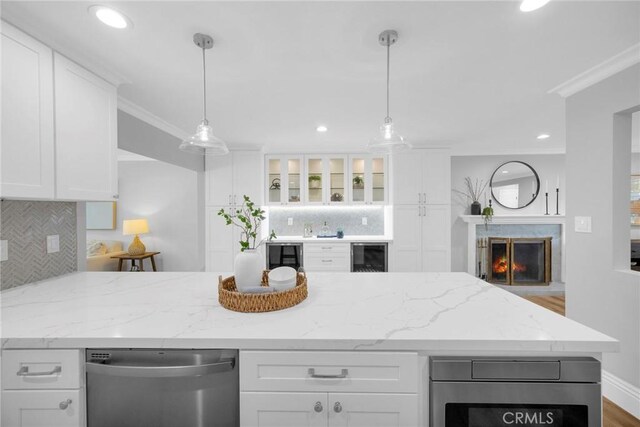 12012 Paseo Bonita, Los Alamitos, CA 90720 - kitchen featuring dishwasher, white cabinets, backsplash, ornamental molding, and recessed lighting