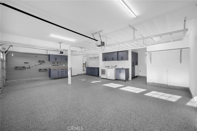 12012 Paseo Bonita, Los Alamitos, CA 90720 - garage featuring a garage door opener and independent washer and dryer