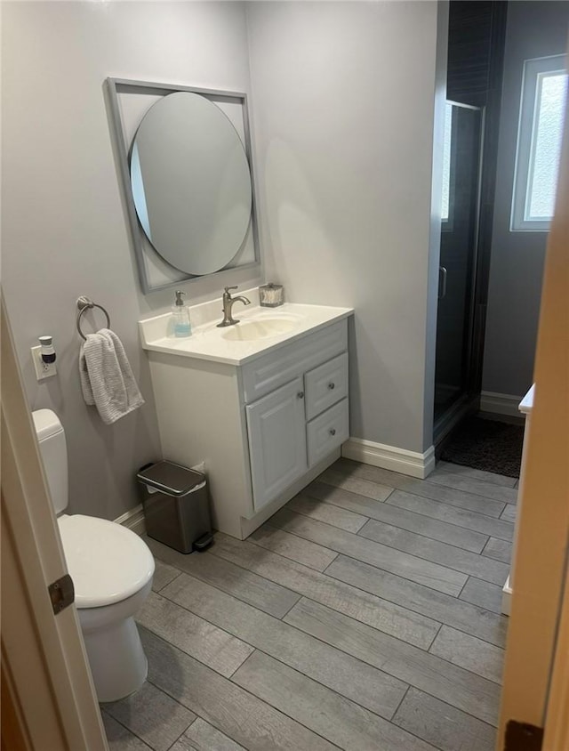 1398 Tartan Cir, Placentia, CA 92870 - bathroom featuring vanity, wood tiled floors, and a stall shower