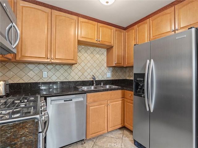 421 E Santa Anita Ave Unit 101, Burbank, CA 91501 - kitchen with appliances with stainless steel finishes, tasteful backsplash, dark stone counters, and light stone finish floors