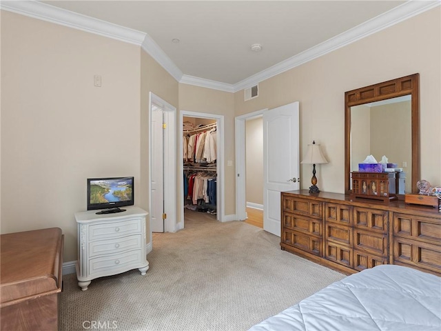 421 E Santa Anita Ave Unit 101, Burbank, CA 91501 - bedroom featuring crown molding, light colored carpet, a spacious closet, and a closet