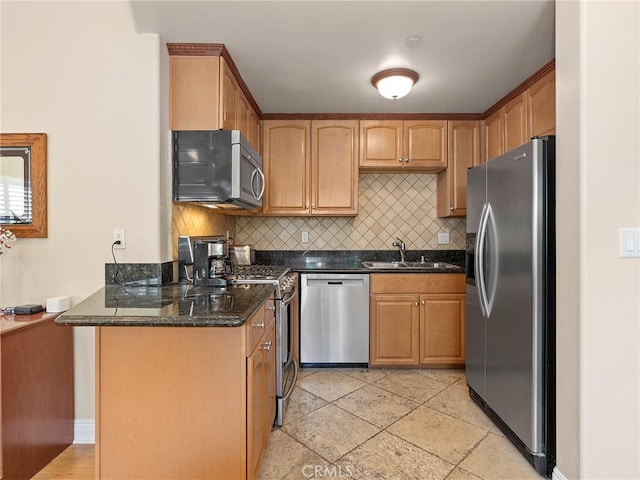 421 E Santa Anita Ave Unit 101, Burbank, CA 91501 - kitchen with stainless steel appliances, backsplash, and dark stone counters