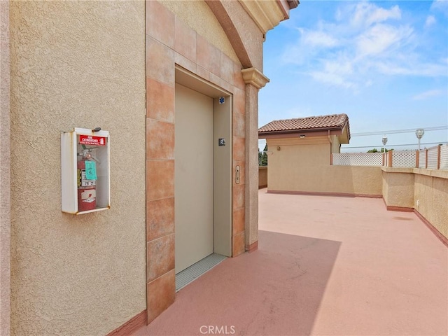 421 E Santa Anita Ave Unit 101, Burbank, CA 91501 - entrance to property with elevator, stucco siding, and a patio