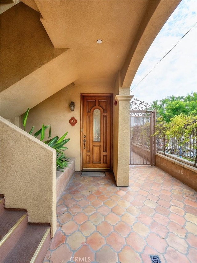 421 E Santa Anita Ave Unit 101, Burbank, CA 91501 - view of exterior entry featuring a gate and stucco siding