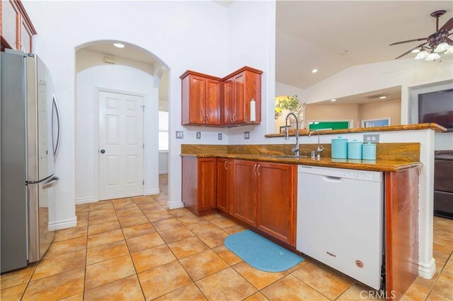 9600 S Loop Blvd, California City, CA 93505 - kitchen featuring white dishwasher, freestanding refrigerator, a peninsula, a ceiling fan, and lofted ceiling
