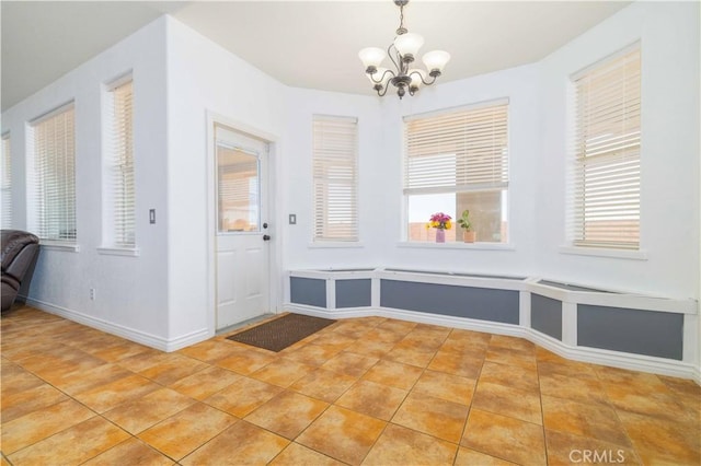 9600 S Loop Blvd, California City, CA 93505 - unfurnished dining area with a chandelier and light tile patterned floors
