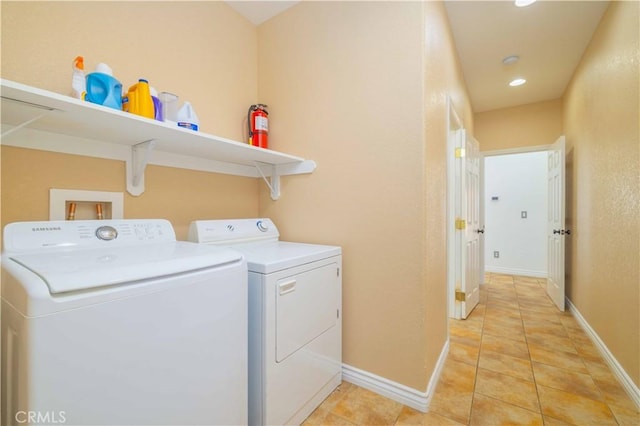 9600 S Loop Blvd, California City, CA 93505 - laundry room with washing machine and clothes dryer, light tile patterned floors, and recessed lighting