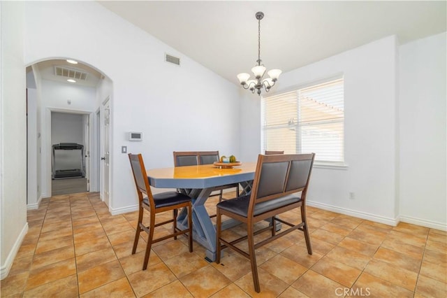 9600 S Loop Blvd, California City, CA 93505 - dining room with arched walkways, a chandelier, light tile patterned flooring, and lofted ceiling