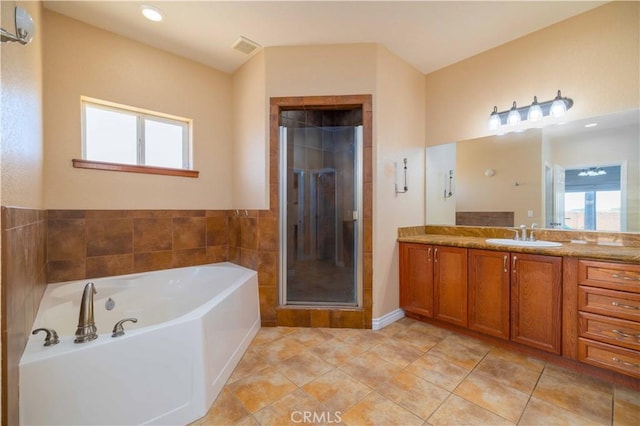 9600 S Loop Blvd, California City, CA 93505 - bathroom featuring vanity, a bath, a stall shower, and tile patterned floors