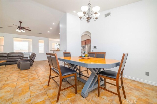 9600 S Loop Blvd, California City, CA 93505 - dining area featuring a chandelier, arched walkways, light tile patterned floors, and recessed lighting